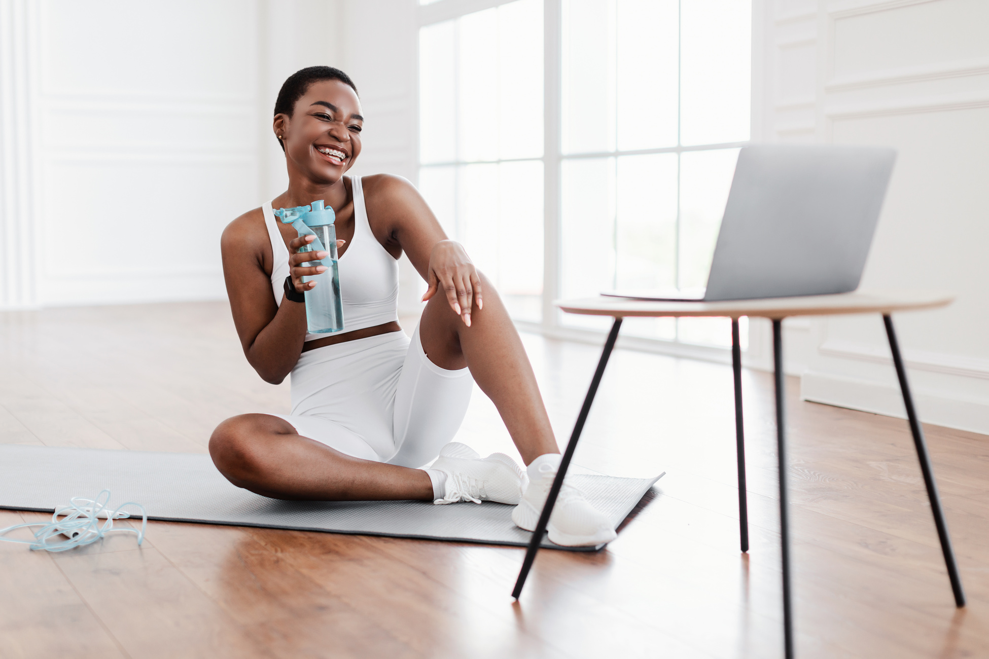 Young Black Woman Woman Talking with Online Coach Using Computer